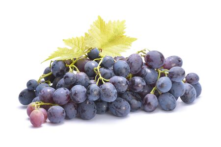 Red grape with green leaf, isolated on whiteの写真素材