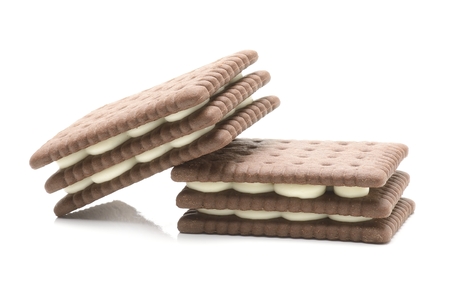 sandwich biscuits with white cream on white backgroundの写真素材
