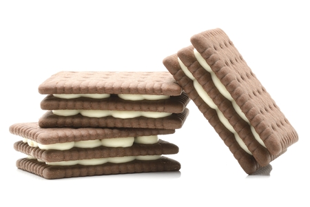 sandwich biscuits with white cream on white backgroundの写真素材