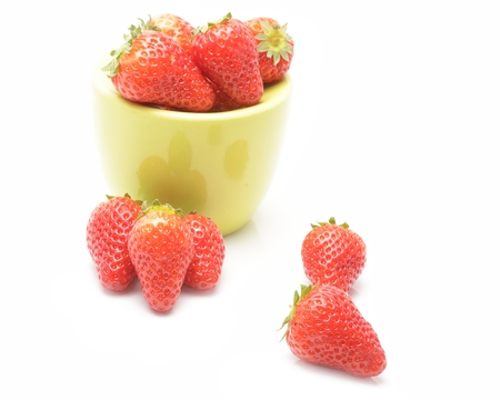 bowl with strawberries isolated on white backgroundの写真素材