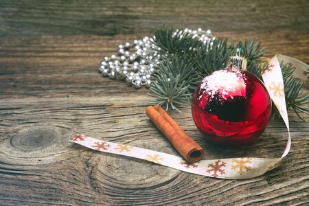 Christmas background with rustic Christmas decorations on wooden tableの写真素材