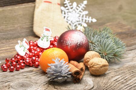 Christmas background with rustic Christmas decorations on wooden tableの写真素材