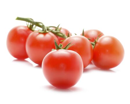 Cherry tomatoes isolated on white backgroundの写真素材