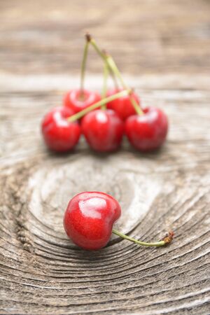 cherries on wooden tableの写真素材