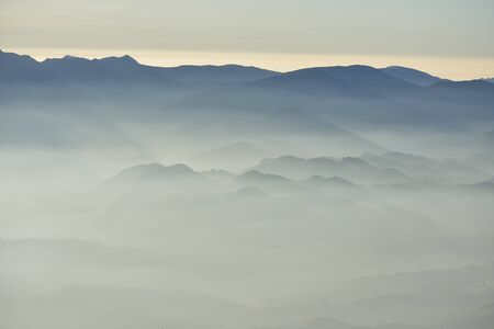 Fog in the valley in the morningの写真素材