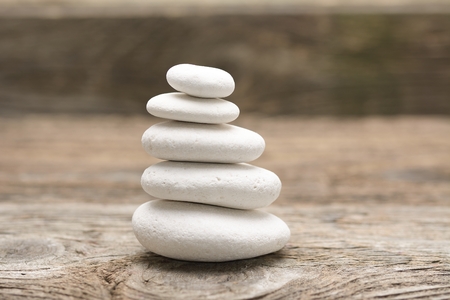 zen stones on the old wooden backgroundの写真素材