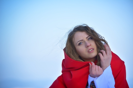 Beautiful blonde woman posing in the snowの写真素材