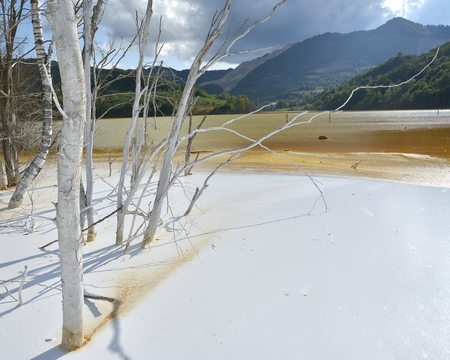 Beautiful landscape with polluted lake by copper miningの写真素材