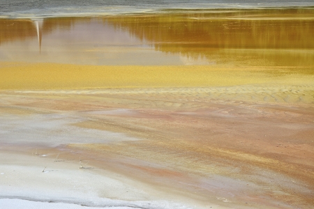 Beautiful landscape with polluted lake by copper miningの写真素材