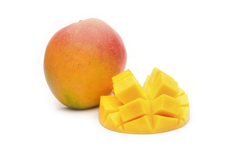 Mango slice cut to cubes close-up isolated on white backgroundの写真素材