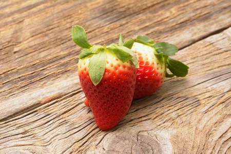 fresh strawberries on the brown wooden tableの写真素材