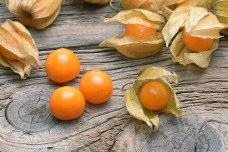 physalis on wooden old tableの写真素材