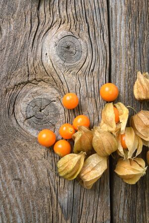 physalis on wooden old tableの写真素材
