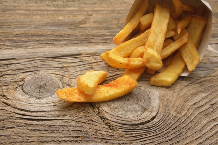 French fries on wooden tableの写真素材