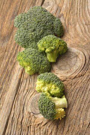 green broccoli organic vegetable on wood boardの写真素材
