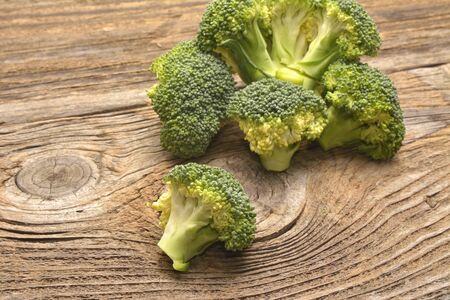 green broccoli organic vegetable on wood boardの写真素材