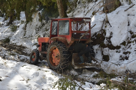 Broken tractor in the forestの写真素材