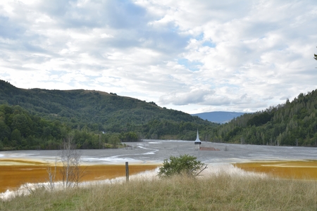 Flooded and abandoned church in the middle of a contaminated lakeの写真素材