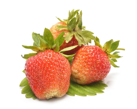 Strawberries with leaves Isolated on a white backgroundの写真素材