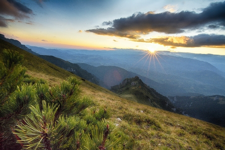 Majestic sunset in the mountains landscape. Carpathian, Romania, Europe.