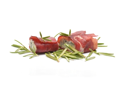 Blue cheese and prosciutto isolated on white backgroundの写真素材