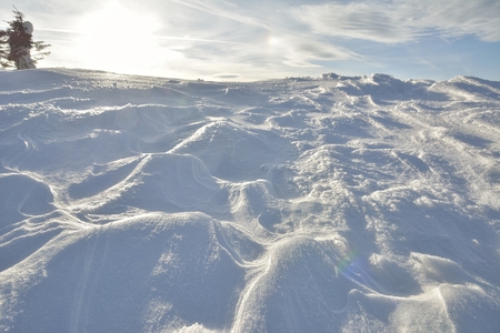 frozen snow in winter in mountainsの写真素材