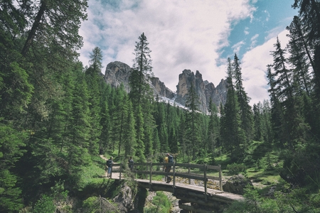 wooden bridge and saent waterfall on italian alps, Ambrizola mountains in Dolomitesの写真素材
