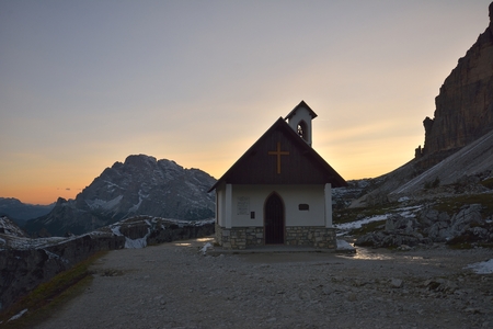 Church at sunset in the mountains tre cime di lavaredo, Italy, Dolomitesの写真素材