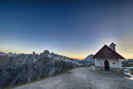 Church at sunset in the mountains tre cime di lavaredo, Italy, Dolomitesの写真素材
