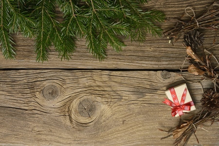 Christmas background with decorations and gift boxes isolated on wooden boardの写真素材