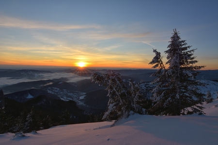 Amazing sunrise in Ceahlau mountains, winter landscape.の写真素材