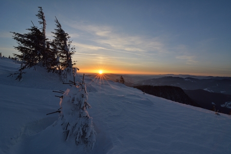 Sunrise above the mountain peaks, view from Ceahlau mountains, Romania.の写真素材