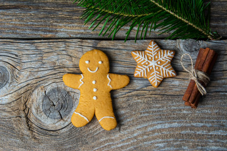 Christmas homemade gingerbread cookies over wooden tableの写真素材