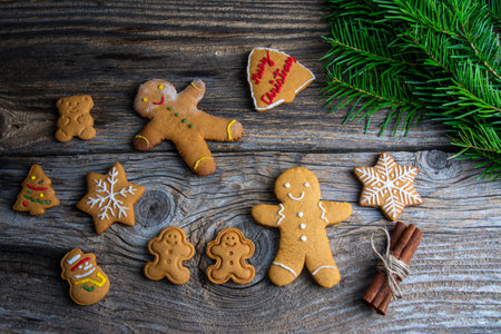 Christmas homemade gingerbread cookies over wooden tableの写真素材