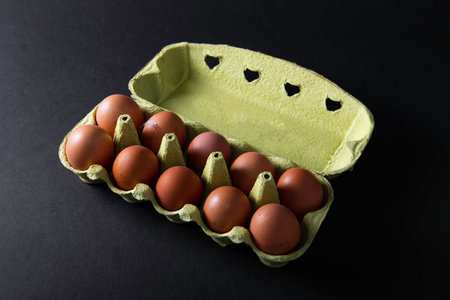 Fresh eggs on black backgroundの写真素材