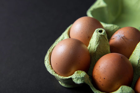 Fresh eggs on black backgroundの写真素材