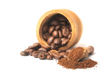 Coffee beans and ground coffee isolated on white backgroundの写真素材