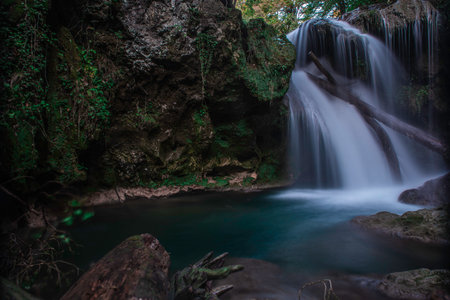 Waterfall in the forest. Carpathian Mountains. Clean water. Mossy rocks. La Vaioaga, Banat, Romania.の写真素材