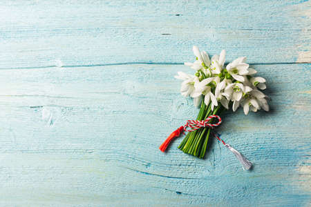 Bouquet of snowdrops on a blue background. gift for March 8, mother's day.の写真素材