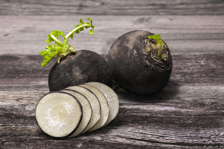 black radish on wooden backgroundの写真素材