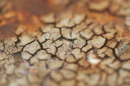 Closeup of peeled paint on a rusted metal barの写真素材
