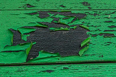 Green paint peeling off. Background texture.の写真素材