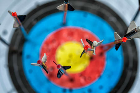 Closeup on arrows in target. Focus on nock. Shallow depth of field.の写真素材