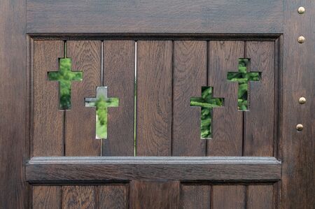 Wooden fence with decorative cut out Christian crossesの写真素材