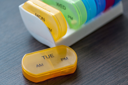 Close-up of medicine dose box. Prescription pills in a pill box.の写真素材