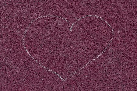 Heart drawing on the ground. Childhood memories.の写真素材