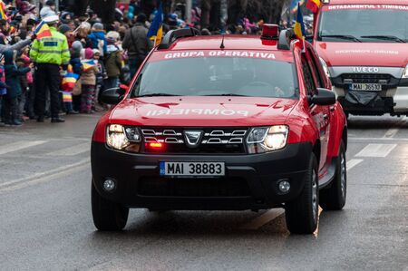 TIMISOARA, ROMANIA - DECEMBER 1, 2017: National Day parade in Romania. Fire department. Fire engine.のeditorial素材