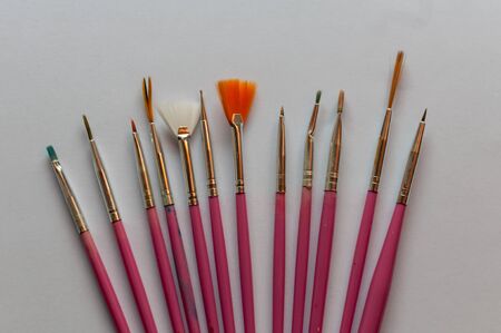 Close-up of painter's brushes isolated on white backgroundの写真素材