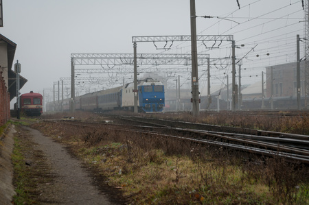 Train arriving in the train station. A misty day