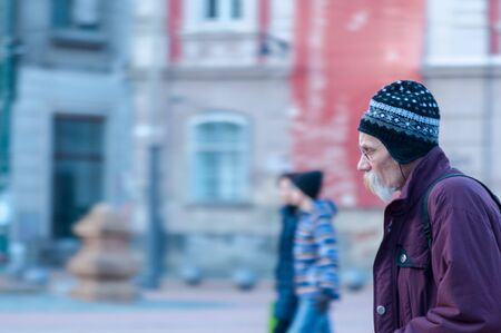 TIMISOARA, ROMANIA - FEBRUARY 05, 2016: Man walking on the street. Motion blur. Real people.のeditorial素材